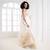 white organza silk saree with zari border and silver golden floral motifs