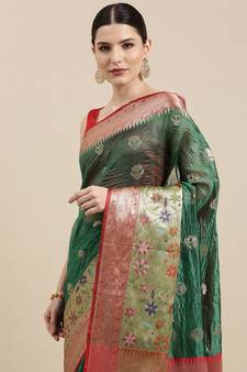 Dark green woven art silk saree with blouse