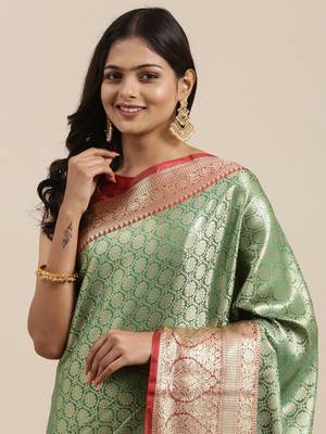Green woven kanchipuram silk blend saree with blouse 1
