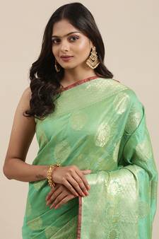 Sea green woven banarasi silk saree with blouse