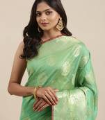 Sea green woven banarasi silk saree with blouse