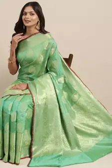 Sea green woven banarasi silk saree with blouse