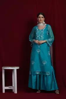 Organza green chikankari kurti with white and golden detailing