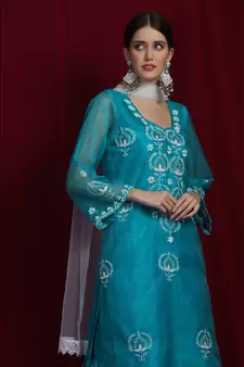Organza green chikankari kurti with white and golden detailing