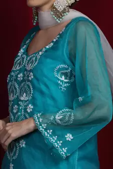 Organza green chikankari kurti with white and golden detailing