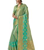 Sea green embroidered organza saree with blouse