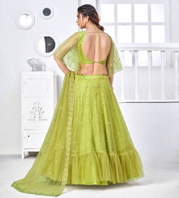 Fascinating Fluorescent Green Thread With Sequins Embroidered Net Party Wear Lehenga Choli 2