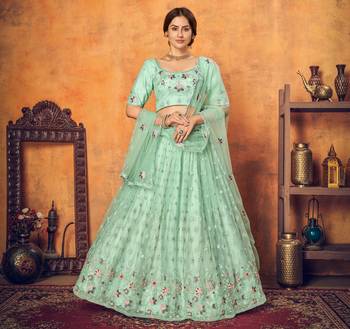 Good Looking Mint Green Thread With Sequins Embroidered Net Semi Stitched Wedding Lehenga 1