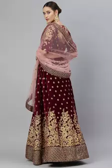 Engaging Purple Zari, Sequins And Thread Embroidered Velvet Semi Stitched Dulhan Lehenga