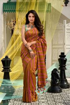 This is  Mustard Cotton handwoven saree with stripes  from Charukriti