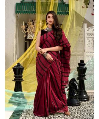 This is  Magenta Cotton handwoven saree with stripes  from Charukriti 1