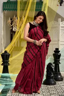 This is  Magenta Cotton handwoven saree with stripes  from Charukriti