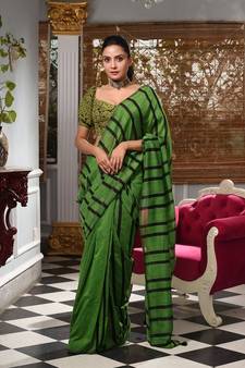 This is  Green Cotton handwoven saree with stripes  from Charukriti