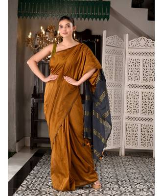 This is  Mustard Cotton  handwoven saree with zari in pallu  from Charukriti 1