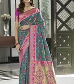 Green woven silk saree with blouse