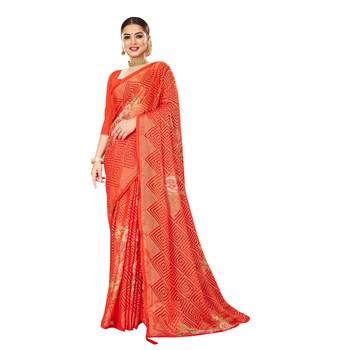 Orange printed brasso saree with blouse 1