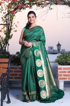 This is   Bottol Green Brocade Silk with traditional motiff from Charukriti