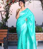 This is   Sea Green Brocade Silk with traditional motiff from Charukriti