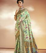 Light green woven silk saree with blouse