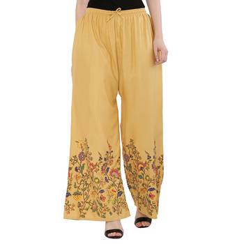 Women Peach Solid Relaxed Flower Print Rayon Palazzo Pants with Elastic Drawstring (Free Size) 1