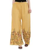 Women Peach Solid Relaxed Flower Print Rayon Palazzo Pants with Elastic Drawstring (Free Size)