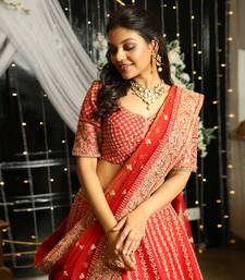Red Lehenga And Blouse In Raw Silk Fabric.