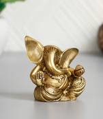brass ganesha idol with modak