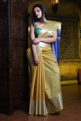 This is   Light Yellow Blended Silk saree with temple border from Charukriti 1