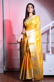 This is   Yellow Blended Silk saree with temple border from Charukriti