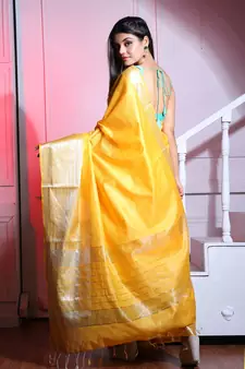 This is   Yellow Blended Silk saree with temple border from Charukriti