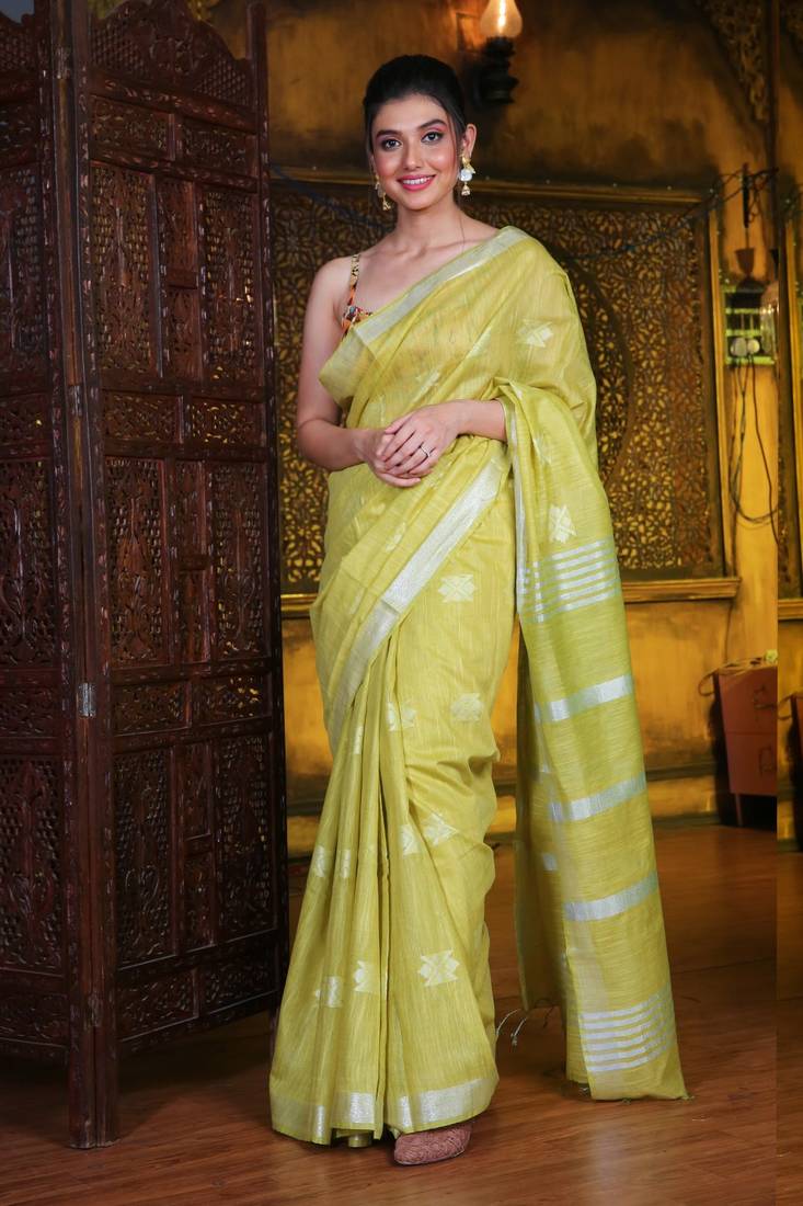 This is   Lime Green Blended Silk soft saree with textured design from Charukriti