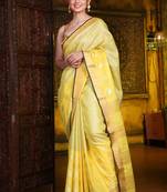 This is   Yellow Blended Silk soft saree with textured design from Charukriti