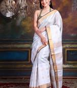 This is   White Tissue soft saree with polka dots from Charukriti