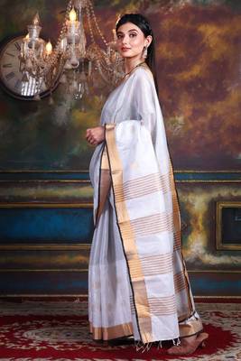 This is   White Tissue soft saree with polka dots from Charukriti 2