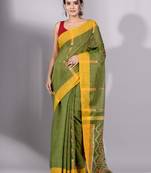 This is   Green Tissue handwoven saree with yellow border from Charukriti
