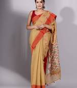 This is   Beige Tissue handwoven saree with red border from Charukriti