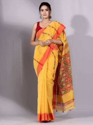 This is   Yellow Tissue handwoven saree with red border from Charukriti 1