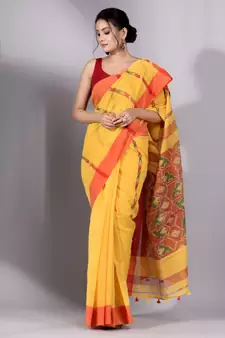 This is   Yellow Tissue handwoven saree with red border from Charukriti