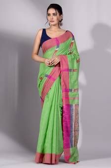 This is   Green Tissue handwoven saree with yellow border from Charukriti