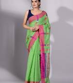 This is   Green Tissue handwoven saree with yellow border from Charukriti