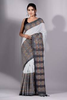 This is   Cream Cotton Handspun soft saree with floral weaving from Charukriti