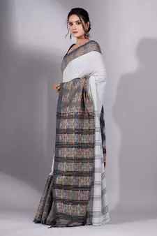 This is   Cream Cotton Handspun soft saree with floral weaving from Charukriti
