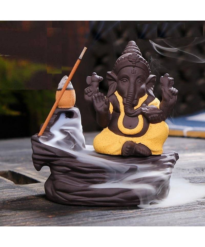 eCraftIndia Yellow Lord Ganesha Decorative Showpiece with 10 free Smoke Backflow Scented Cone Incenses