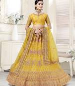 Fetching Mustard Yellow Dori And Thread Embroidered With Diamond Work Bridal Net Semi Stitched Lehenga Choli