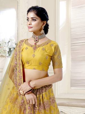 Fetching Mustard Yellow Dori And Thread Embroidered With Diamond Work Bridal Net Semi Stitched Lehenga Choli 2