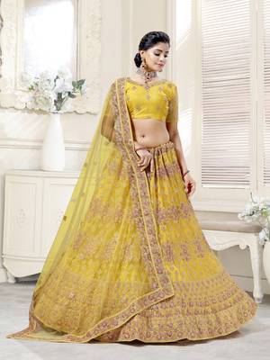 Fetching Mustard Yellow Dori And Thread Embroidered With Diamond Work Bridal Net Semi Stitched Lehenga Choli 3