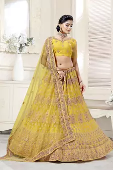 Fetching Mustard Yellow Dori And Thread Embroidered With Diamond Work Bridal Net Semi Stitched Lehenga Choli