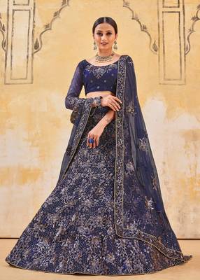 hypnotizing Peacock Blue Double Multi Sequins and Thread Embroidered Bridal Net  Semi Stitched Lehenga choli 1
