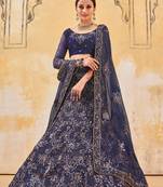 hypnotizing Peacock Blue Double Multi Sequins and Thread Embroidered Bridal Net  Semi Stitched Lehenga choli