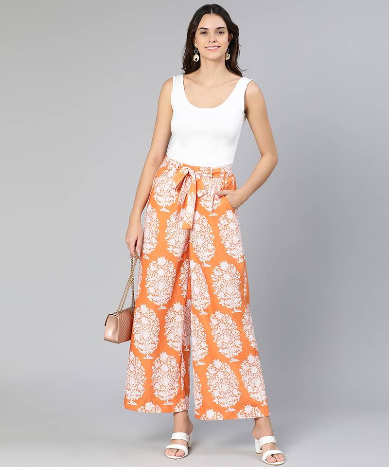 Orange colored printed elasticated women tie -knot pant